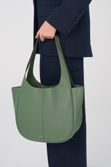 Profile view of model wearing the Oroton Emilia Tote in Moss and Pebble Leather for Women