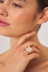 Profile view of model wearing the Oroton Posy Ring in Gold/White and Brass Base With 18CT Gold Plating/ Fresh Water Pearl for Women