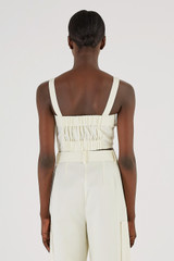 Profile view of model wearing the Oroton Button Detail Bodice in Cream and 77% Cotton 23% Linen for Women