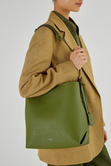 Profile view of model wearing the Oroton Margot Hobo in Ivy and Pebble Leather for Women