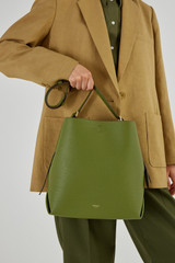 Profile view of model wearing the Oroton Margot Hobo in Ivy and Pebble Leather for Women