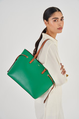 Profile view of model wearing the Oroton Harriet Medium Tote in Emerald and Saffiano Leather for Women