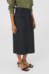 Profile view of model wearing the Oroton Tailored Midi Skirt in Black and 100% Cotton for Women