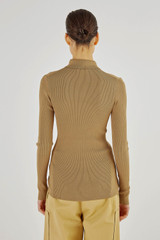 Profile view of model wearing the Oroton Long Sleeve Rib Cardi in Tobacco and 77% Viscose 23 % Polyester for Women
