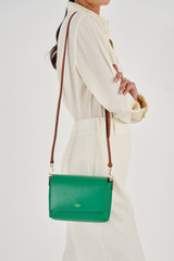 Profile view of model wearing the Oroton Harriet Crossbody in Emerald and Saffiano Leather for Women