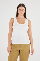 Profile view of model wearing the Oroton Knit Tank in White and 83% Viscose, 17% Polyester for Women