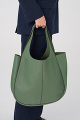 Profile view of model wearing the Oroton Emilia Large Tote in Moss and Pebble Leather for Women