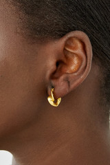 Profile view of model wearing the Oroton Mimi Mini Huggies in Worn Gold and  for Women