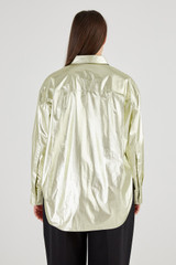 Profile view of model wearing the Oroton Gold Overshirt in Gold and 80% Cotton 20% Polyester for Women