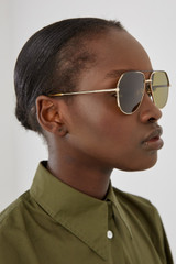Profile view of model wearing the Oroton Sunglasses Valo in Gold/Vintage Tort and Monel/ Acetate for Women