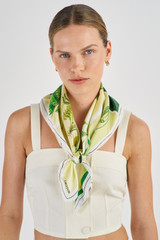 Profile view of model wearing the Oroton Fern Garden Silk Scarf in Cream and 100% Silk for Women