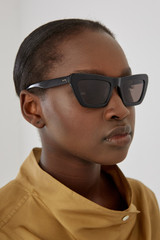 Profile view of model wearing the Oroton Sunglasses Alba in Black and Acetate for Women