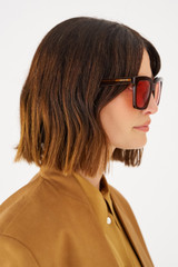 Profile view of model wearing the Oroton Sunglasses Eilian in Caramel and Acetate for Women