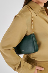 Profile view of model wearing the Oroton Asha Baguette Crossbody in Juniper and  for Women