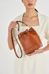 Oroton Harvey Small Bucket in Cognac and Oroton Logo Printed Coated Canvas. Smooth Leather Trims for Women