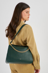 Profile view of model wearing the Oroton Asha Medium Hobo in Juniper and Pebble Leather for Women