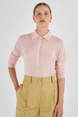Profile view of model wearing the Oroton Merino 3/4 Sleeve Polo in Iced Pink and 100% Merino Wool for Women