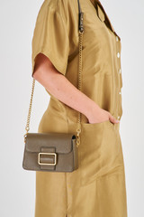 Profile view of model wearing the Oroton Astrid Crossbody in Olive and Pebble Leather for Women