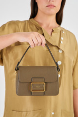 Profile view of model wearing the Oroton Astrid Crossbody in Olive and Pebble Leather for Women