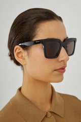 Profile view of model wearing the Oroton Sunglasses Easton in Black and Acetate for Women