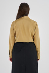 Profile view of model wearing the Oroton Slim Fit Silk Shirt in Tobacco and 93% Silk 7% Spandex for Women