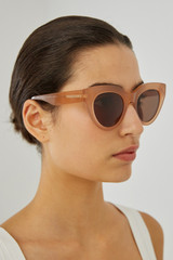 Profile view of model wearing the Oroton Sunglasses Dallas in Orange and Acetate for Women