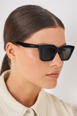 Profile view of model wearing the Oroton Sunglasses Astrid Polarised in Black and Acetate for Women