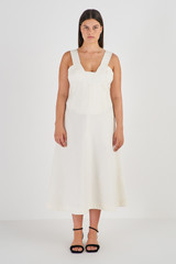 Profile view of model wearing the Oroton Bodice Detail Dress in Cream and 58% Viscose 42% Linen for Women