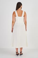 Profile view of model wearing the Oroton Bodice Detail Dress in Cream and 58% Viscose 42% Linen for Women