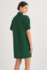 Profile view of model wearing the Oroton Mesh Polo Shift Dress in Treehouse and 83% Viscose, 17% Polyester for Women