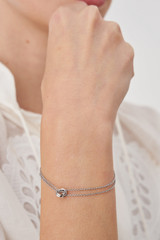 Profile view of model wearing the Oroton Wrenley Bracelet in Silver and Brass Base Metal With Rhodium Plating for Women