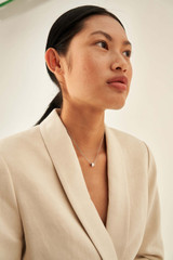 Profile view of model wearing the Oroton Phoebe Necklace in Silver/Crystal and Brass Base With Rhodium Plating for Women