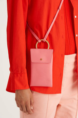 Profile view of model wearing the Oroton Maeve Phone Crossbody in Strawberry and Smooth Leather for Women