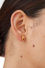 Profile view of model wearing the Oroton Mayla Studs in Worn Gold and Brass Base With 18CT Gold Plating for Women
