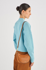 Profile view of model wearing the Oroton Florence Small Shoulder Bag in Cognac and Smooth leather for Women