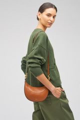 Profile view of model wearing the Oroton Florence Small Shoulder Bag in Cognac and Smooth leather for Women