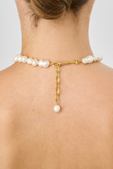 Profile view of model wearing the Oroton Marlee Necklace in Worn Gold/White and Brass for Women
