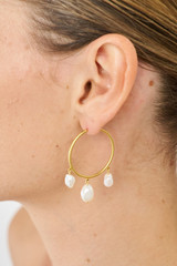 Profile view of model wearing the Oroton Marlee Triple Hoops in Worn Gold/White and Brass for Women
