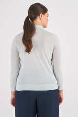 Profile view of model wearing the Oroton Merino 3/4 Sleeve Polo in Pale Amalfi and 100% Merino Wool for Women