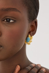 Profile view of model wearing the Oroton Tropea Earrings in Worn Gold/Turquoise and 18-karat gold plating for Women