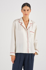 Profile view of model wearing the Oroton Contrast Trim PJ Shirt in Cream and 100% Silk for Women