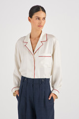Profile view of model wearing the Oroton Contrast Trim PJ Shirt in Cream and 100% Silk for Women
