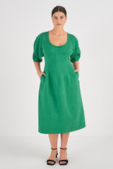 Profile view of model wearing the Oroton Sculptured Dress in Kelly Green and 58% Viscose 42% Linen for Women