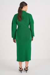 Profile view of model wearing the Oroton Long Sleeve Rib Knit Dress in Juniper Green and 83% Viscose 17 % Polyester for Women