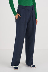 Profile view of model wearing the Oroton Tab Detail Pleat Pant in North Sea and 58% Viscose 42% Linen for Women