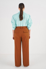Profile view of model wearing the Oroton Tab Detail Pant in Wicker and 100% Cotton for Women