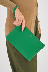 Profile view of model wearing the Oroton Eve Medium Pouch in Emerald and Pebble Leather for Women