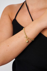 Profile view of model wearing the Oroton Sierra Bracelet in Gold and  for Women