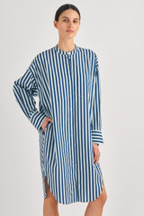 Profile view of model wearing the Oroton Long Sleeve Stripe Shirt Dress in North Sea and 100% Cotton for Women