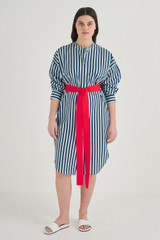 Profile view of model wearing the Oroton Long Sleeve Stripe Shirt Dress in North Sea and 100% Cotton for Women
